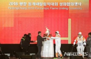 Pyeongchang Winter Paralympic torch-relay with the Auxiliary Robot ‘WalkOn Suit’
