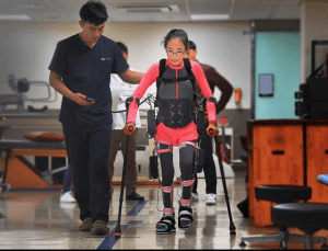 the eleven years old girl ‘s wearing a robot’s , Instead of a wheelchair,  “I like the feeling of walking”
