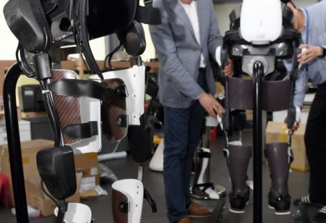 Spine disorder girl, worn wearable robot and walk